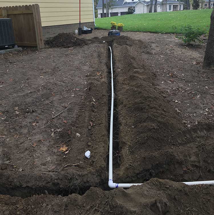 Trenched piping dark soil