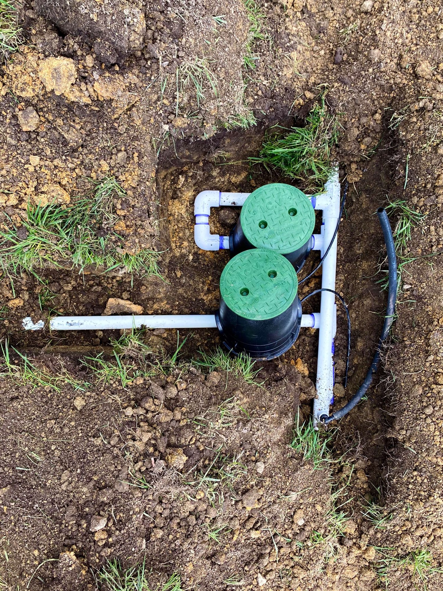 Irrigation manifold with covers on