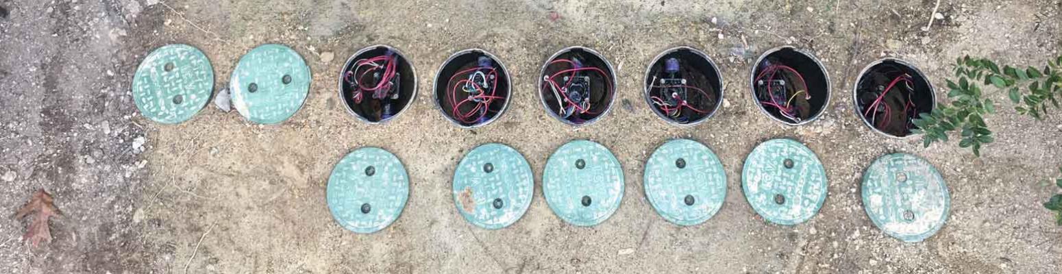 Irrigation valve manifold with the lids off