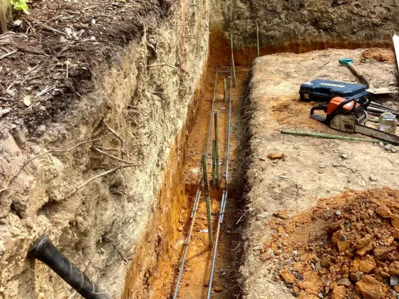 Trenches dug in preparation for building a retaining wall