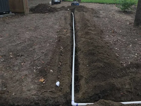 Irrigation trench in wet soil